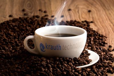 Tasse Kaffee mit krauth Logo 